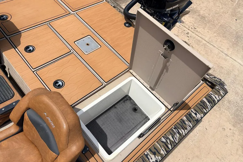 Slide: The Image of 2023 Avid 21 XB Elite boat interior with open storage compartment and seating. - 50