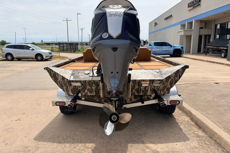 Slide: The Image of 2023 Avid 21 XB Elite boat with powerful outboard motor on trailer. - 6