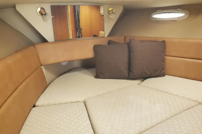 Slide: The Image of Cozy interior of 2016 Cutwater 28 boat with cushioned seating and pillows. - 6