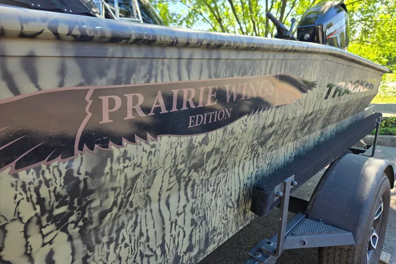 Slide: The Image of 2026 Tracker Grizzly 1650 T Prairie Wings Edition boat with camouflage design. - 10