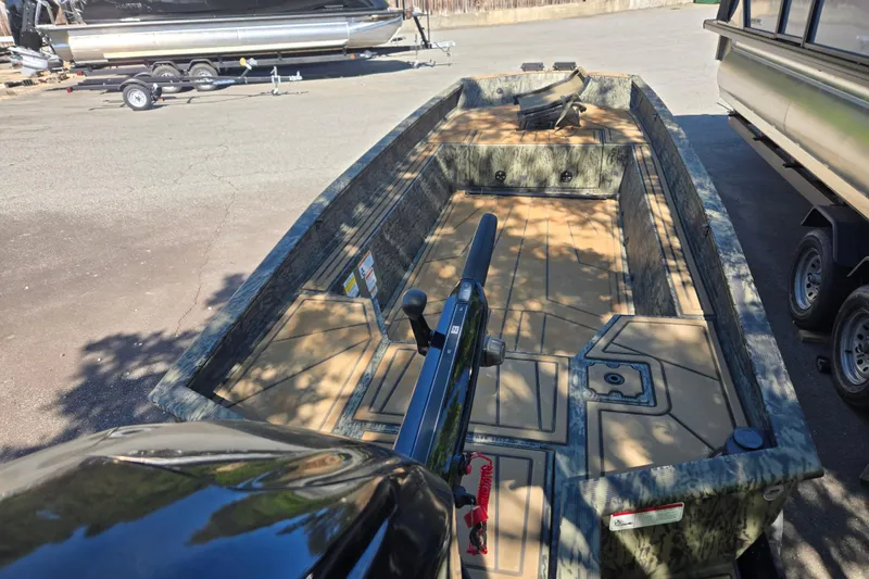 Slide: The Image of 2026 Tracker Grizzly 1650 T Prairie Wings Edition boat with camouflage interior design. - 3