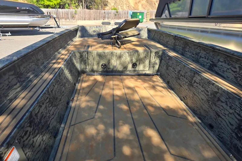 Slide: The Image of 2026 Tracker Grizzly 1650 T Prairie Wings Edition boat interior with camouflage design. - 8