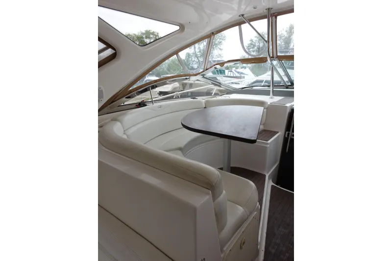 Slide: The Image of Luxurious interior of 2009 Regal Commodore 4460 yacht with elegant seating and table. - 12