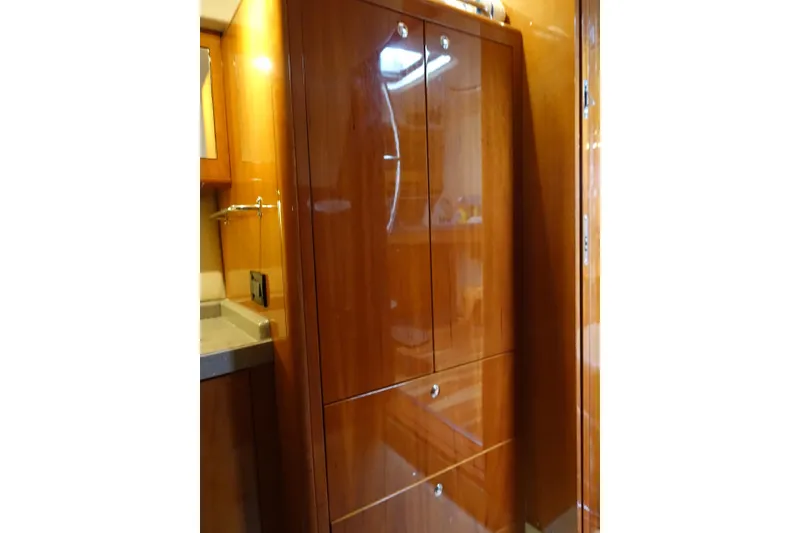Slide: The Image of Luxurious wooden cabinetry inside 2009 Regal Commodore 4460 yacht interior. - 13