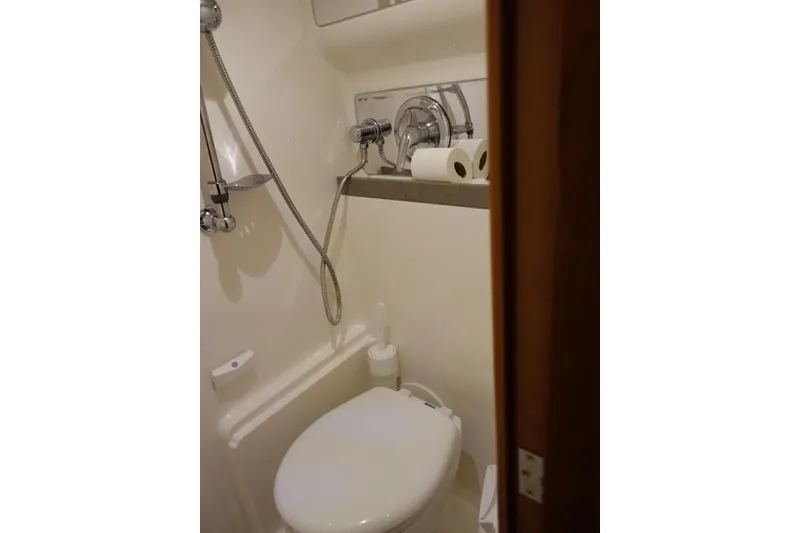 Slide: The Image of Compact bathroom in 2009 Regal Commodore 4460 yacht with shower and toilet. - 16