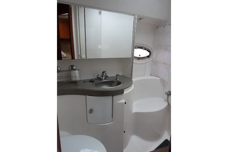 Slide: The Image of Bathroom interior of 2009 Regal Commodore 4460 yacht with sink and mirror. - 19