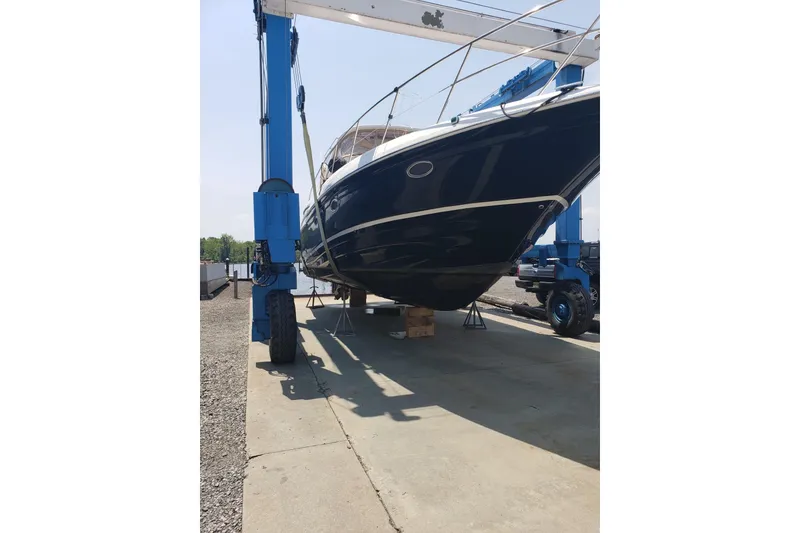 Slide: The Image of 2009 Regal Commodore 4460 yacht on lift, dockside maintenance. - 2