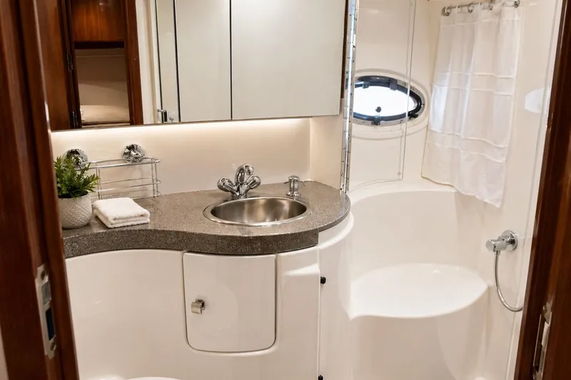 Slide: The Image of Luxurious 2009 Regal Commodore 4460 yacht bathroom with modern fixtures and elegant design. - 28