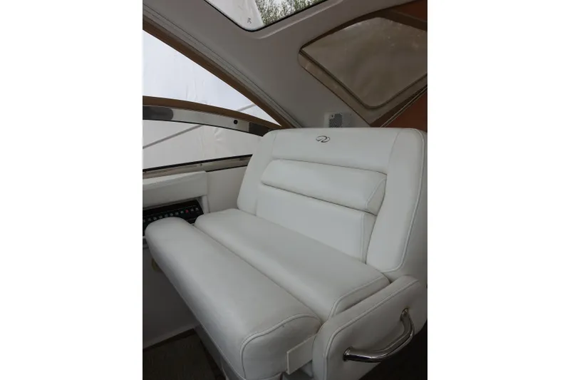Slide: The Image of Luxurious white seating in 2009 Regal Commodore 4460 yacht interior. - 3