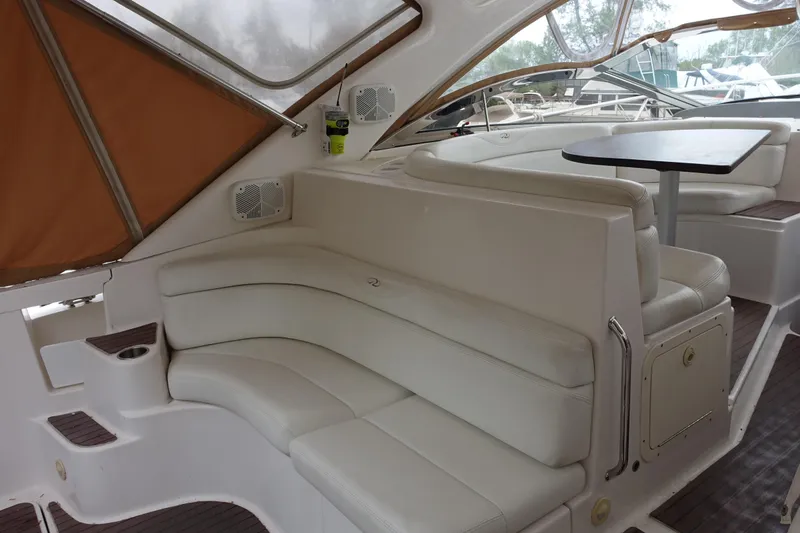 Slide: The Image of Luxurious interior of 2009 Regal Commodore 4460 yacht with white seating and table. - 8