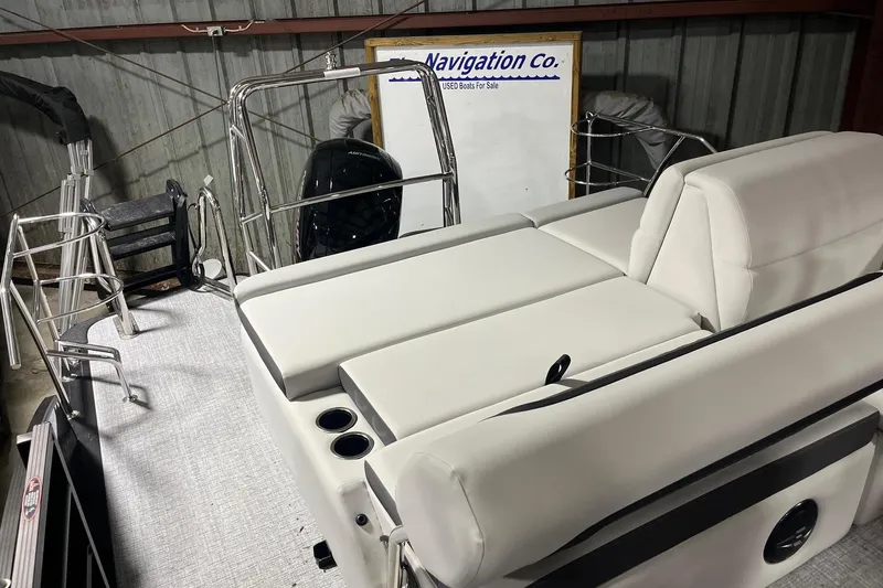Slide: The Image of 2026 Harris Cruiser 210 SLDH boat interior with white seating and metal railings. - 3