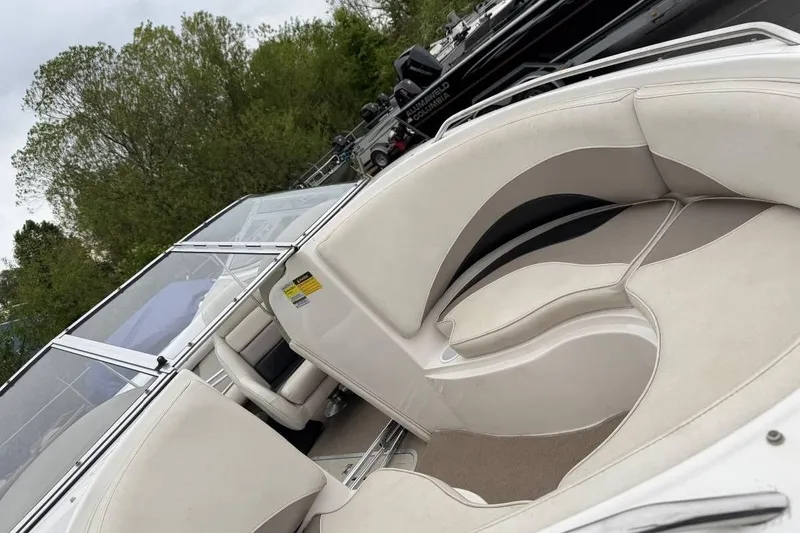 Slide: The Image of 2001 Ebbtide Campione 200 boat interior with white seating and windshield. - 4