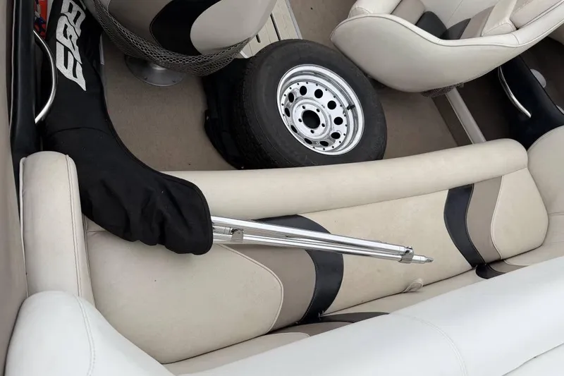 Slide: The Image of Interior of a 2001 Ebbtide Campione 200 boat with spare tire and equipment. - 7