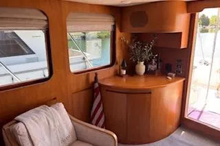 Slide: The Image of Interior of 2006 Ocean Alexander 48 Sedan yacht with elegant wood finish and cozy seating. - 10