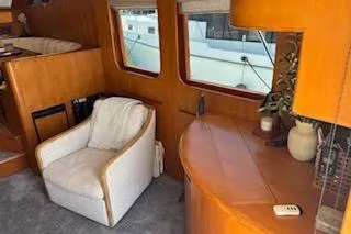 Slide: The Image of Luxurious interior of 2006 Ocean Alexander 48 Sedan yacht with cozy seating. - 11