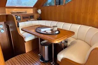Slide: The Image of Luxurious interior of 2006 Ocean Alexander 48 Sedan yacht with elegant wood and leather seating. - 13