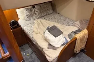 Slide: The Image of Cozy bedroom in 2006 Ocean Alexander 48 Sedan yacht with neatly arranged bedding. - 18