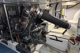 Slide: The Image of Engine room of 2006 Ocean Alexander 48 Sedan yacht, showcasing mechanical components. - 24