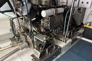 Slide: The Image of Engine room of 2006 Ocean Alexander 48 Sedan yacht, showcasing mechanical components. - 25