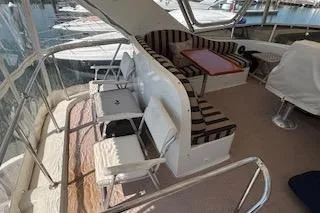Slide: The Image of 2006 Ocean Alexander 48 Sedan yacht interior with seating and table. - 5