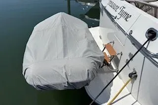 Slide: The Image of 2006 Ocean Alexander 48 Sedan yacht with covered dinghy at the stern. - 7
