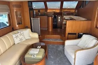 Slide: The Image of Luxurious interior of a 2006 Ocean Alexander 48 Sedan yacht with elegant seating and wood finishes. - 8