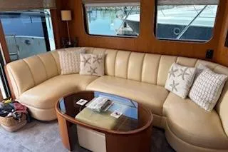Slide: The Image of Luxurious interior of 2006 Ocean Alexander 48 Sedan yacht with plush seating and elegant decor. - 9