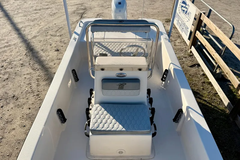 Slide: The Image of 2026 Carolina Skiff E16 JVX CC boat interior with seating and steering console. - 13