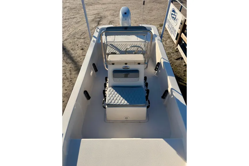 Slide: The Image of 2026 Carolina Skiff E16 JVX CC boat interior with seating and steering console. - 14