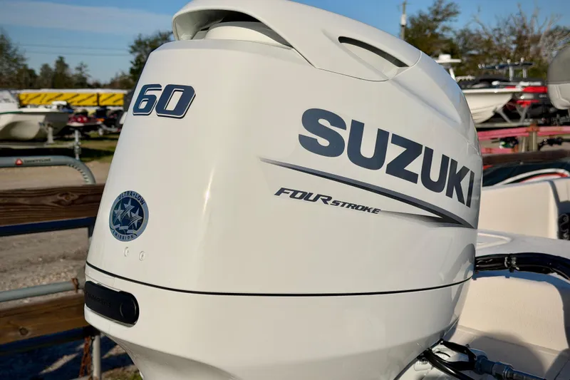 Slide: The Image of Suzuki 60 horsepower outboard motor on 2026 Carolina Skiff E16 JVX CC boat. - 3