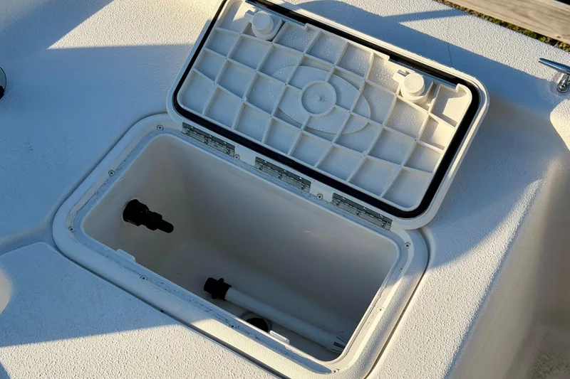 Slide: The Image of Open storage compartment on 2026 Carolina Skiff E16 JVX CC boat. - 8