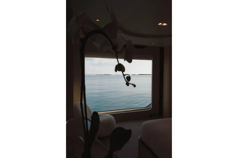 Slide: The Image of Luxurious interior view from Azimut Grande 32M yacht, overlooking serene ocean waters. - 10