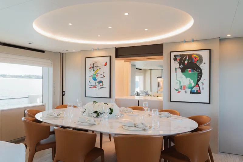 Slide: The Image of Luxurious dining area on 2023 Azimut Grande 32M yacht with elegant decor and modern art. - 12