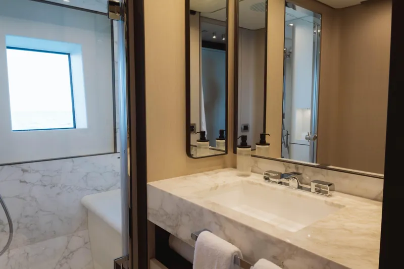 Slide: The Image of Luxurious bathroom on 2023 Azimut Grande 32M yacht with marble sink and modern fixtures. - 15