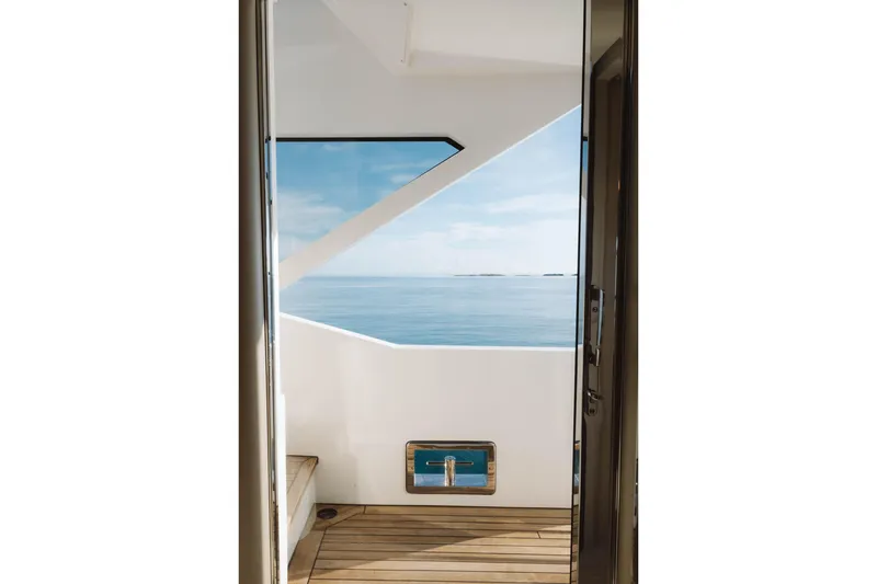 Slide: The Image of View from Azimut Grande 32M yacht, showcasing ocean and sleek deck design, 2023 model. - 16