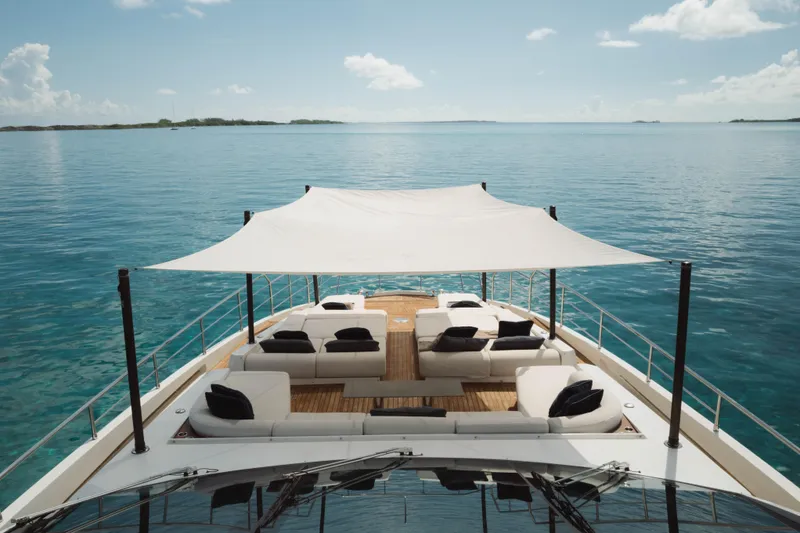 Slide: The Image of Luxurious 2023 Azimut Grande 32M yacht with elegant deck seating and ocean view. - 27