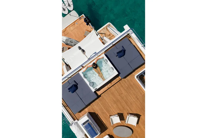 Slide: The Image of Aerial view of 2023 Azimut Grande 32M yacht deck with jacuzzi and seating area. - 5