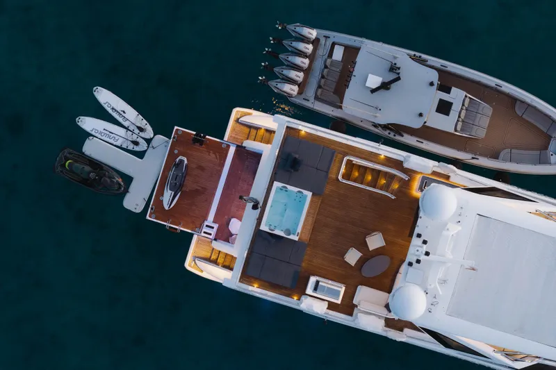 Slide: The Image of Aerial view of 2023 Azimut Grande 32M yacht with watercraft and paddleboards. - 8