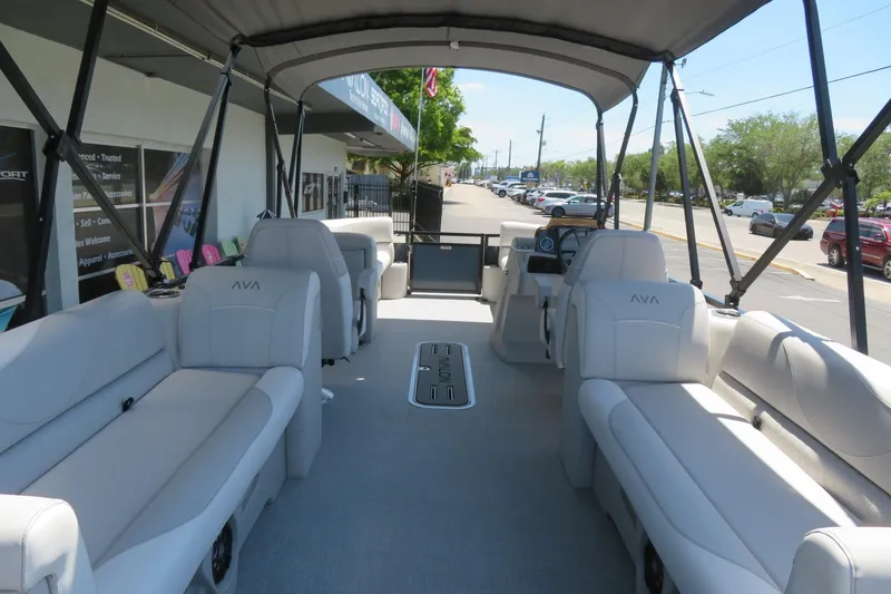 Slide: The Image of 2026 Avalon Venture 85 Quad Lounge boat interior with spacious seating and canopy. - 19