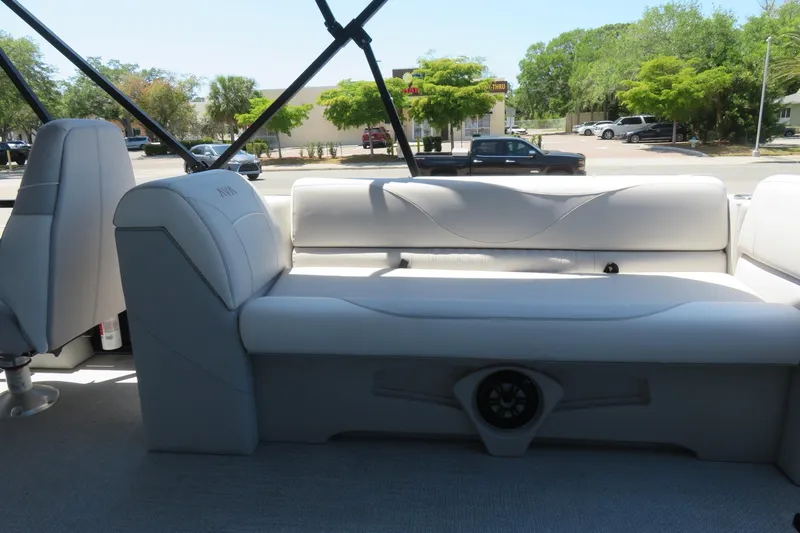 Slide: The Image of Interior of 2026 Avalon Venture 85 Quad Lounge boat with plush seating and speaker system. - 21