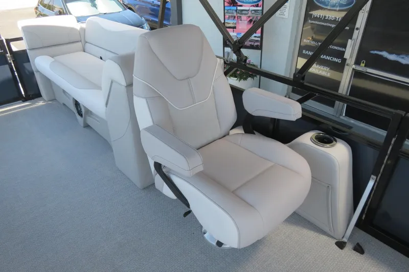 Slide: The Image of Luxurious seating on 2026 Avalon Venture 85 Quad Lounge boat, featuring plush upholstery. - 31