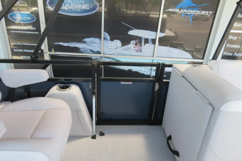 Slide: The Image of Interior of 2026 Avalon Venture 85 Quad Lounge boat, featuring comfortable seating and modern design. - 32