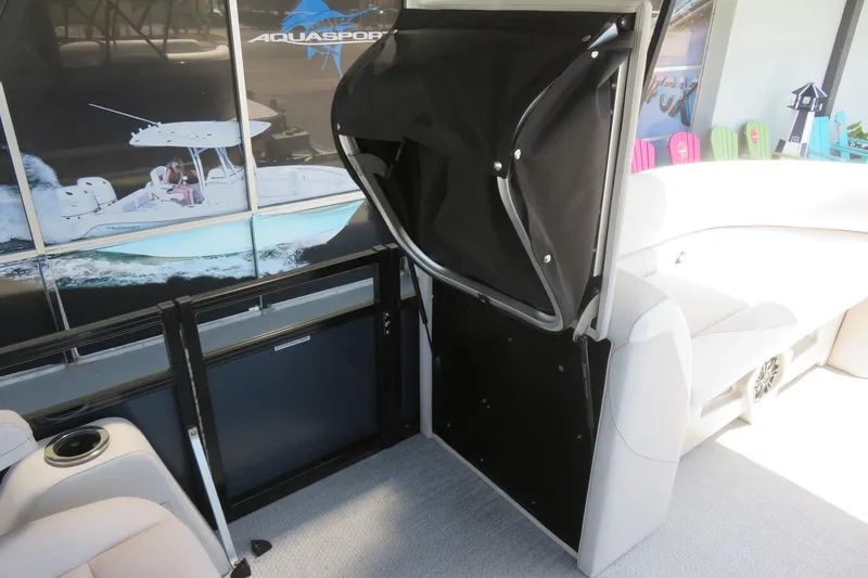 Slide: The Image of 2026 Avalon Venture 85 Quad Lounge interior with seating and storage compartment. - 34