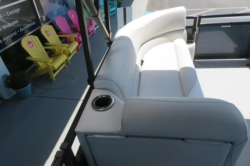 Slide: The Image of Luxurious seating on 2026 Avalon Venture 85 Quad Lounge boat, featuring cup holders and modern design. - 37