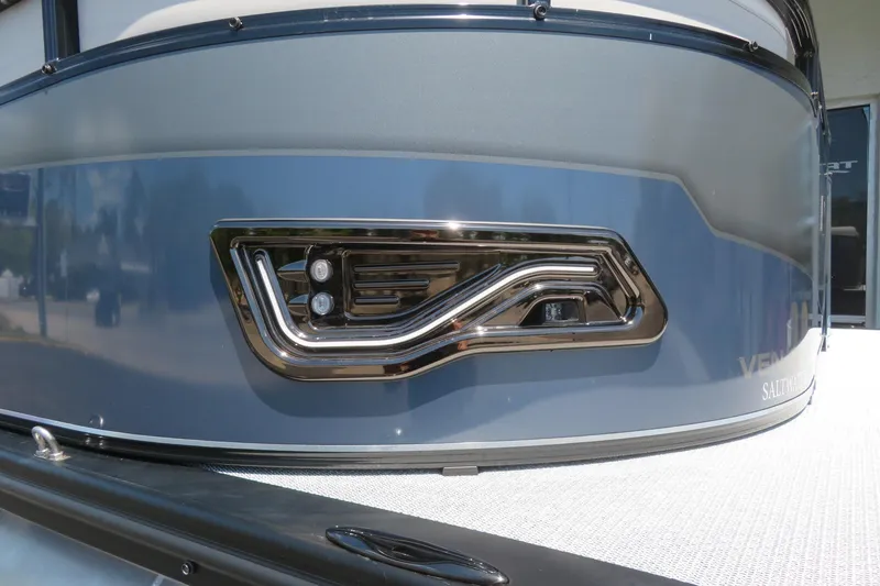 Slide: The Image of 2026 Avalon Venture 85 Quad Lounge boat, sleek blue exterior with modern chrome detailing. - 4