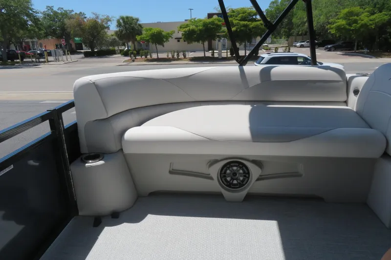 Slide: The Image of Luxurious seating on 2026 Avalon Venture 85 Quad Lounge boat, featuring sleek design and integrated speaker. - 40