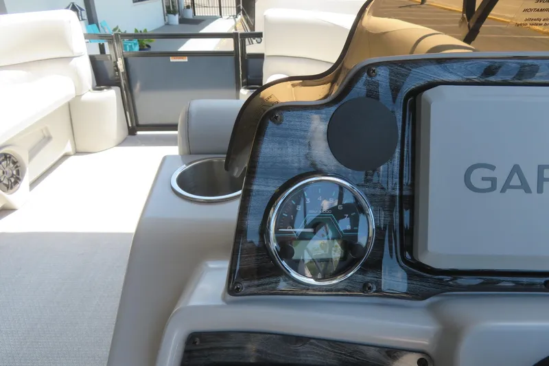Slide: The Image of Dashboard of 2026 Avalon Venture 85 Quad Lounge boat with Garmin display and gauge. - 46
