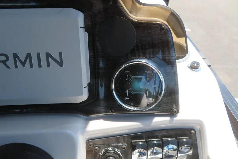 Slide: The Image of Dashboard of 2026 Avalon Venture 85 Quad Lounge boat with Garmin device and fuel gauge. - 48