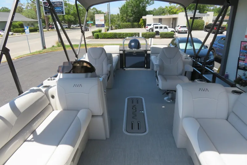 Slide: The Image of 2026 Avalon Venture 85 Quad Lounge boat interior with plush seating and modern design. - 52