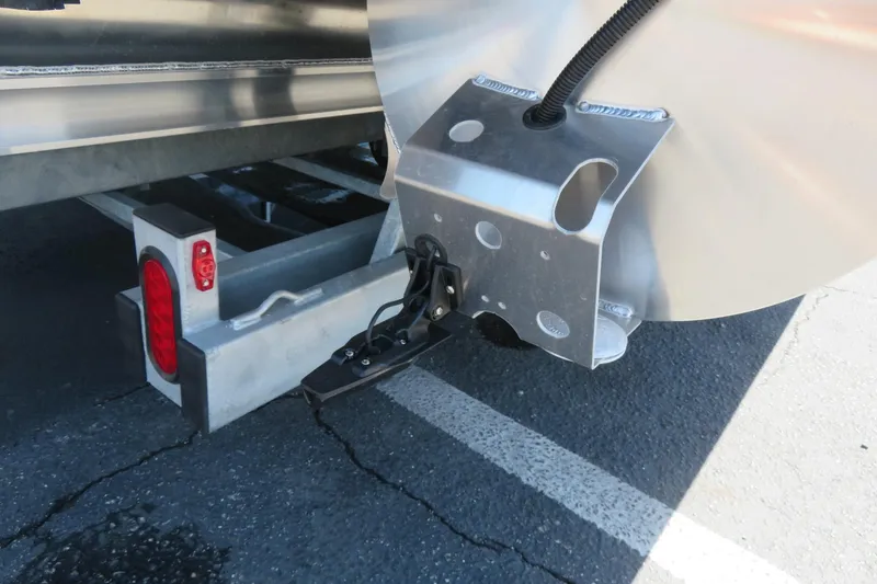 Slide: The Image of Trailer hitch and rear light of 2026 Avalon Venture 85 Quad Lounge boat. - 9